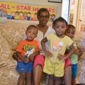 Katherine Weatherby is surrounded by her 2-year-old grandchildren (from left) Zirean Davis, G’Niereya Alston and Bryson Ward at her home in Sallis, Mississippi, on Aug. 20, 2015. (Photo by MSU Human Sciences/Amy Barefield)