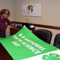 Paula Threadgill, associate director of the Mississippi State University Extension Service and state leader of 4-H, reviews a poster that will hang in the 4-H Village in the Trademart in Jackson during the Mississippi State Fair from Oct. 7-18. The photo was taken at MSU on Oct. 2, 2015. (Photo by MSU Ag Communications/Linda Breazeale)