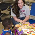 This is an image of Anna Hughes, a field technical assistant with the Early Years Network helped with post-tornado child care at a Red Cross Shelter in Louisville, MS in May, 2014.