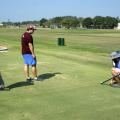 Mississippi State University Department of Plant and Soil Sciences senior research associate Wayne Philley, left, and MSU seniors Abram Diaz of D’Iberville and Aaron Tucker of Carthage measure how far a golf ball rolls over different varieties of bermudagrass at the R. R. Foil Plant Science Research Center Sept. 4, 2015. (Photo by MSU Ag Communications/Nathan Gregory)