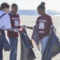 Jessica Lero, left, records the types of trash Kaileb Williams, center, and Laila Williams found while participating in the 2016 Mississippi Coastal Cleanup on Oct. 22 in Biloxi, Mississippi, with their Mississippi State University Extension Service 4-H club in Harrison County. They joined about 2,400 volunteers to collect more than an estimated 10 tons of trash during the 28th annual event. (Photo by MSU Extension Service/Susan Collins-Smith)