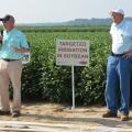 Jason Krutz (left), irrigation specialist for the Mississippi State University Extension Service, and Normie Buehring, research professor at the Northeast Mississippi Experiment Station, discuss soybean irrigation at the 2014 North Mississippi Research and Extension Center Agronomic Row Crops Field Day. The biennial event will be Aug. 11, 2016 in Lee County. (File Photo/ MSU Extension Service) 
