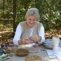 Judy Breland, Mississippi State University Extension Service agent in Stone County, demonstrates pine needle basket weaving at the 2015 Piney Woods Heritage Festival at the MSU Crosby Arboretum in Picayune, Mississippi. The 2016 festival is set for Nov. 18 and 19. (Photo by Mississippi State University Extension Service/Pat Drackett)
