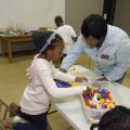 Sandra Jackson, an agent of the Mississippi State University Extension Service in Winston County, helps 6-year-old Akilah Goss assemble a Lego maze March 16, 2017. Jackson was the first agent to teach the 4-H Lego Engineering Club curriculum, which is a STEM program geared toward 4-H’ers aged 5 to 7. (Photo by MSU Extension/Kevin Hudson)