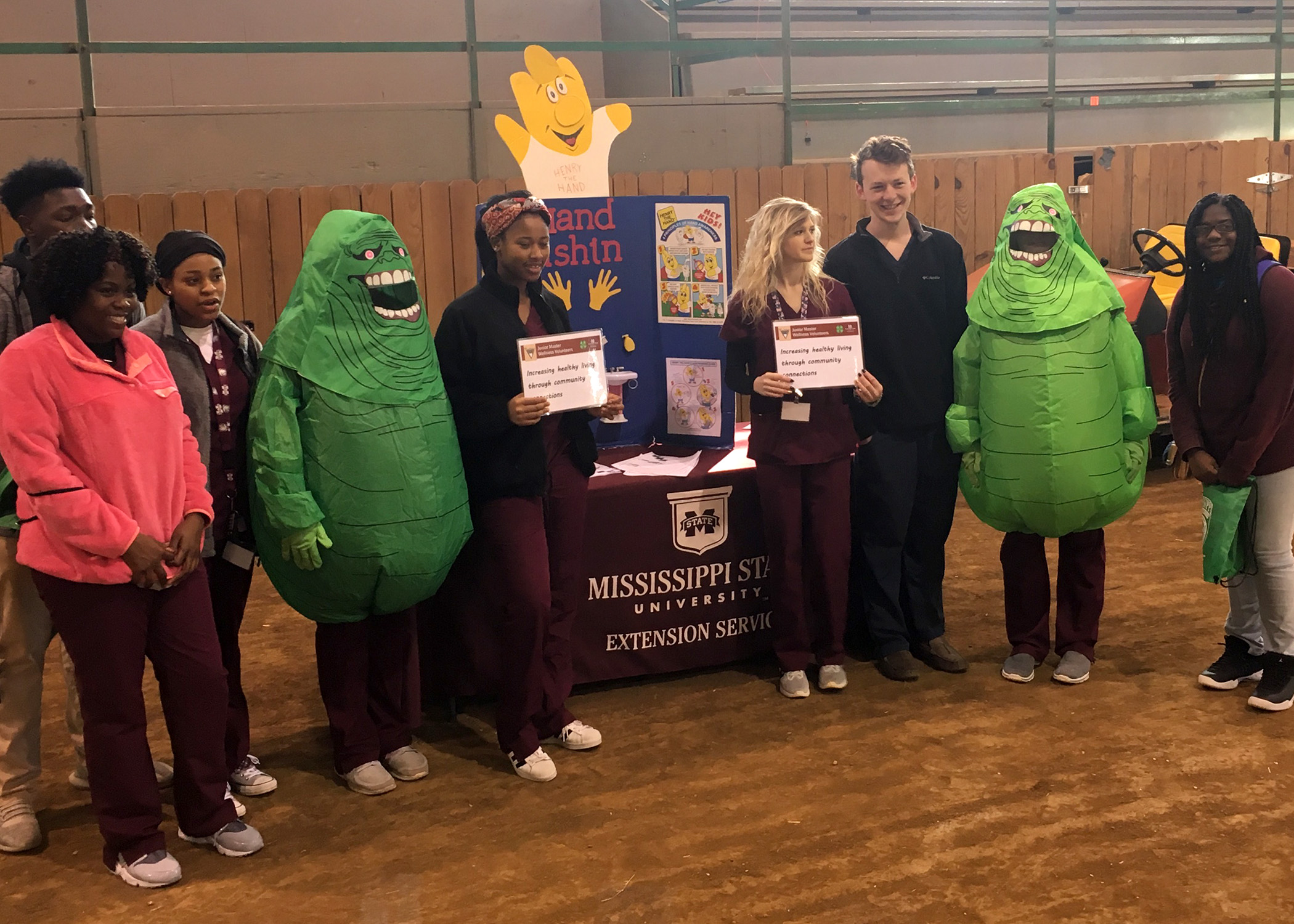 Jr Master Wellness Volunteers are discussing the importance of drinking water as opposed to sugary drinks.