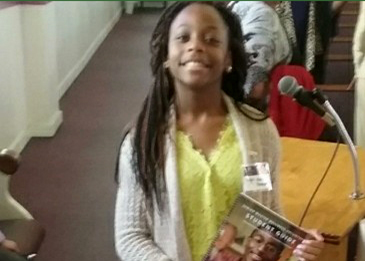 A girls giving a presentation on diabetes at her church.