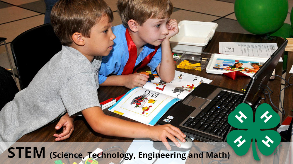 The header for the STEM section of 4-H. The image portrays youth using the LEGO software for Robotic creations.